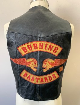 NEW AGE COLLECTION, Black, Leather, Solid, Logo , Biker Vest, Snap Front, V-neck, Western Style Yoke, Large "BURNING BASTARDS" Graphic Patch in Back with Red and Ochre Winged Skulls