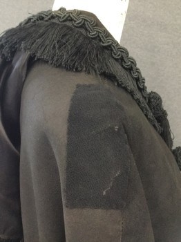 Womens, Cape 1890s-1910s, EVA'S, Black, Leather, Rayon, Solid, N/S, Black Suede Cape with Black Trim with Fringe at Sailor Collar. 4 Tassles at Front, Hook & Eye Closure, Trim at Center Front, Sun Damage at Shoulder. Repair on Both Shoulders Under Collar. See Photos for Close Up. Some Wear and Dis coloring at Neckline and Hemline