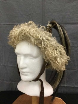 Unisex, Historical Fiction Headpiece, M.T.O, Khaki Brown, Lt Brown, Bronze Metallic, Leather, Synthetic, 24", Mongolian Hat/helmet. Aged Brown Leather Crown with Brass Findings, Dirty Cream/khaki Shearling Trim At Crown and Horsehair Tail At Crown Top. Adjustable Leather Buckled Chin Strap