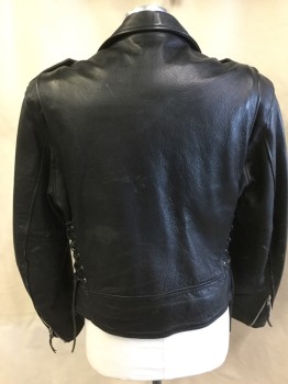 WILSONS, Black, Leather, Solid, Black Texture and Black Lining,  Biker Style, Collar Attached, Metal Studs, Off Side Zip Front, Epaulettes, Long Sleeves with Zipper Hem, Side Lacing, Belt on Hem, (Scratches/peels on Elbow)
