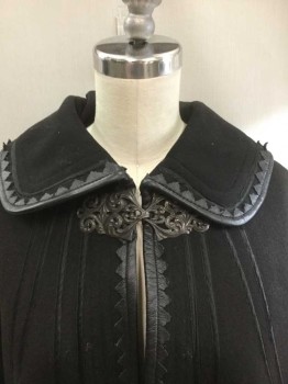 Womens, Cape 1890s-1910s, N/L, Black, Wool, Leather, Solid, O/S, Wool with Silk Satin Stripe Accents, Leather Zig Zagged Edging, Round Collar, Metal Ornately Swirled Clasp at Center Front Neck