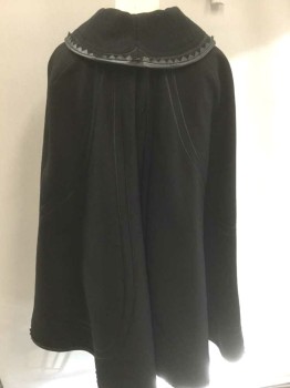 Womens, Cape 1890s-1910s, N/L, Black, Wool, Leather, Solid, O/S, Wool with Silk Satin Stripe Accents, Leather Zig Zagged Edging, Round Collar, Metal Ornately Swirled Clasp at Center Front Neck