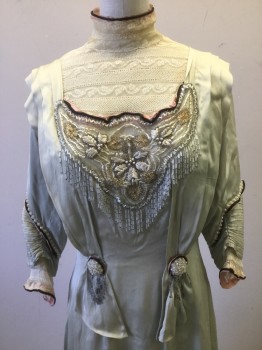 Womens, Evening Dress 1890s-1910s, MTO, Sage Green, Cream, Pink, Black, Silver, Silk, Beaded, Solid, Floral, W:26, B:32, Faded Sage Satin with Delicate Ivory Lace, High Neck with Black and Pink Trim, Pleated Shoulder Detail, 1/4 Sleeve with Pin Tuck Detail/ Pearl and Beading Detail and Black and Pink Trim, Bodice Netting with Silver/white Beading/khaki Embroidery, Circle Brooch with Silver Beading Fringe, Long Skirt with Ruffled Underlayer, **stain on Front Skirt**,
