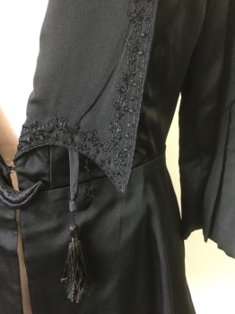 Womens, Jacket 1890s-1910s, N/L , Black, Silk, Solid, W:34, B:42, 3/4 Sleeves, Long Collar/Lapel with Pointed Ends, Black Floral Embroidery, Self Ties Hanging From Neck with Tassle Ends, Box Pleated Detail at Cuffs, Half Moon Shaped Embroiderred Closure at Center Front Waist, Lining is Black and Gold Vertical Stripes, Made To Order