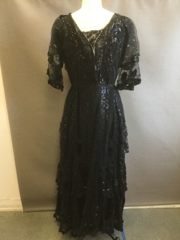 Womens, Evening Dress 1890s-1910s, MTO, Black, Beige, Sequins, Silk, Floral, W:34, B:38, Black Lace Dress with Beading and Sequins Throughout, Beige Floral Embroidery, V-neck, Puffed Sleeve with Wide Ruffle and Velvet Floral Appliqués, Satin Sash Drapes From Waist and Beaded Appliqués, Ruffled Lace Tiers on Skirt with Sequins, Silk and Velvet Under Layer at Hem,