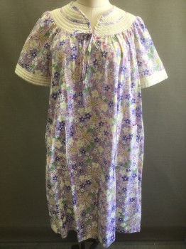 Womens, Housedress, FUNDAMENTAL, Lavender Purple, Lt Pink, White, Lt Green, Yellow, Cotton, Polyester, Floral, L, Lavender with Pastel Floral Pattern, Solid White Quilted Detail at Cuffs and Rounded Yoke at Neck, Short Sleeves, Snap Front, 2 Patch Pockets at Hips, Attached Self Fabric Strings to Tie Bow at Center Front Neck, Hem Below Knee