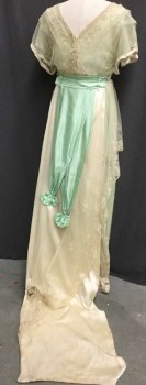 Womens, Evening Dress 1890s-1910s, Cream, Mint Green, Silk, Cotton, Solid, Floral, 28, 32, Bodice Is A Mint Chiffon with Cream Embroidered Mesh Overlay and Satin Trim. Attached Mint Satin Cummerbund, Cream Embroidered Mesh Apron Over Mint Chiffon Floor Length Skirt. Double Cream Silk Underskirt with Ruffle Hem. Back Waist Has Mint Double Sash Detail and Cream Rectangular Train with Lace Overlay and Silk Floret Applique All Bordered In French Knot Embroidery,