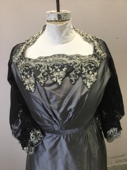 Womens, Evening Dress 1890s-1910s, N/L (MTO), Gray, Black, Cream, Polyester, Cotton, Solid, Floral, W32, B40, Gray Taffeta Dress. Square Neckline with Black & Cream Lace Trim. 3/4 Length Taffeta Sleeves with Jetted Black Beaded Lace Cuffs & Black & Cream Lace Trim with Black Lace Overlay Mantel Sleeves. Lace Sleeves Terribly Frayed, Supported with Black Tulle. Hook & Eye Closure at Center Back Bodice. Skirt with Self Train,