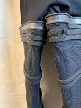 Mens, Jumpsuit, MTO, Black, Spandex, Rubber, Solid, Diamonds, W 36, C 42, G 62, Round Neck,  Back Zipper, Set Sleeves with Rubber Rings and Attached Neoprene Gauntlets with Thumb Holes. Textured Inserts. Rubber Rings Around Legs and Attached Greaves Ending in Spandex Boot Spats.some Damage on Rings at Inner Thigh