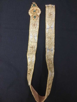 Unisex, Historical Fiction Belt, N/L, Gold, Synthetic, Metallic/Metal, Shimmer Light Gold W/sparkling Gold Ornate Embossed, Gold Metal, with Gold Trim with Tan Leather Lining, Diamond Shape Gold Buckle W/green Stones, See Photo Attached,