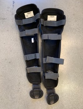 Unisex, Sci-Fi/Fantasy Greaves, D, Gray, Black, Fiberglass, Nylon, Pair, Molded Armor with Pebbled Texture, Nylon Base, Metal Rivets, Webbed Straps with Velcro, Full Calf Length with Attachment for Upper Feet, Aged/Dirty