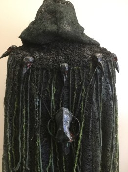 Black, Gray, Green, Red, Lime Green, Rubber, Plastic, Robe with Hood, Rubber Mesh with Green, Silver Spayed Paint, Long Green Yarn Hanging Down, Black Bird Heads with Red Eyes Carved Out Hanging Along Chest & Back, 1 Big Black Skull Hanging in the Back, Open Front, with Black Fabric Tie at Neck
