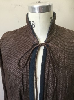Mens, Coat, Mto, Dk Brown, Slate Blue, Silk, Grid , Solid, Ch40, Asian Influenced. Brown Textured Grid Outer with Slate Blue Raw Silk Lining. High Tapered Collar Bland. 2 Tie Self Closure at Center Front, Slits at Sleeve Lower. Slit Panells at Skirt of Coat, All Around.