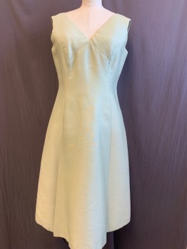 Mto, Mint Green, Silk, Solid, Soft Twill , Sleeveless ,Vneck Princess Seamed Front and Back , Seams Create  Pleated Flap in Front, Metal Zipper Back , Black Smudge Mark on Left Side of Skirt.