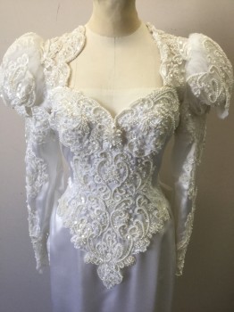 N/L, White, Polyester, Solid, Floral, Satin with Off White Lace in Ornate Pattern Across Bodice, Shoulders, Upper Back and Sleeves,with Pearls and Clear Sequined Detail Throughout, V Shaped Detail at Waist, Long Sleeves, Top of Sleeves are Puffy Tulle While Rest of Sleeve is Form Fitting, Plunging Sweetheart Bust, Open Detail at Back Shoulders with Hanging Beads, Oversized Self Fabric Bow with 2 Rosettes at Bum, Floor Length Tapered Skirt,