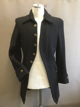 MTO, Black, Wool, Solid, Cut Away Coat in Boiled Wool, Cotton Lining. 4 Faux Buttons & Button Holes at Cut Away.buttons at Cuffs, 2 Pocket Flaps with Buttons. Slit at Center Back, Inverted Pleat Detail at Side Seams at Back. All Buttons Brass Colored. Inverted Pleat at Center Back,