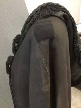 EVA'S, Black, Leather, Rayon, Solid, Black Suede Cape with Black Trim with Fringe at Sailor Collar. 4 Tassles at Front, Hook & Eye Closure, Trim at Center Front, Sun Damage at Shoulder. Repair on Both Shoulders Under Collar. See Photos for Close Up. Some Wear and Dis coloring at Neckline and Hemline