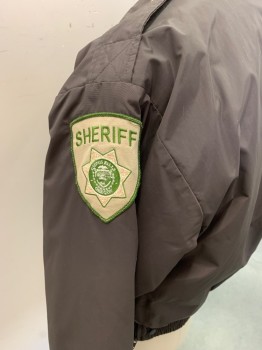 FLYING CROSS, Dk Brown, Nylon, Polyester, Solid, Dark Brown with Light Khaki and Pea Green "Sheriff" Patch on Left Arm, USA Flag Patch on Right Arm, Zip Front, 4 Pockets with Gold Buttons on 2, Gold Button on Epaulettes, Elastic Cuffs and Waistband, Removable Liner with Barcode Written on Right Armscye