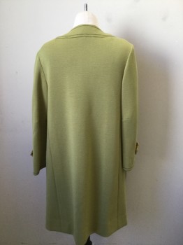 N/L, Chartreuse Green, Wool, Polyester, Solid, Coat. of Muted Chartreuse GreenWool Jersey with Olive Green Trim Lines. Poly Lining in Turmeric with Brown & Green Paisley Print. 6 Gold Button Front Single Breasted, Button Down Tabs at Cuffs.some Damage to Left Neck Front