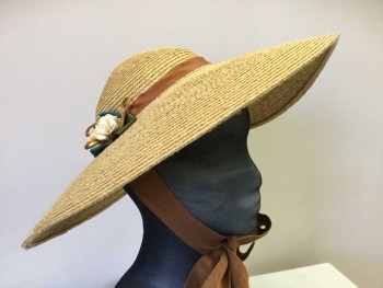 MTO, Tan Brown, Brown, Teal Blue, Green, Cream, Straw, Silk, Straw Wide Brim Floppy Sun Hat, Brown Ribbon Hat Band, Cream Ribbon Florets On Sides with Green/Teal Blue Ribbon Bow Behind, Brown Silk Loops Behind Florets, Brown Grosgrain Ribbon Chin Tie