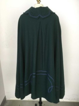 N/L, Emerald Green, Blue, Wool, Rayon, Solid, Winter Cape, Peter Pan Collar with 2 Button Tabs at Front with Blue Soutache Trim, Brown Rayon Lining. Inverted Pleat at Center Back, Novelty Panelling at Back Collar