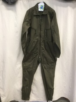 N/L, Dk Green, Poly/Cotton, Solid, Flight Suit, Zip Front, Collar Attached, Long Sleeves, 6+ Pockets, Zip Slit Sleeves, Tab Snaps at Waist, Zip Slit Legs, Orange Painted Numbers/Logo on Right Sleeve