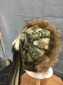 M.T.O., Brown, Gray, Brass Metallic, Black, Cream, Leather, Fur, Mongolian Hat/ Helmet. Worn Brown Leather Hat with Brown Fur Hat Band & Gray Rabbit Fur Panels with Brass Studs and Findings. Black & Cream Horsehair Tail At Top Of Crown. Brown Leather Adjustable Chin Strap with Buckle