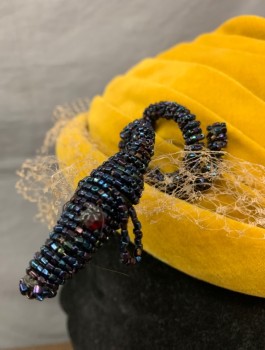 SHERMAN, Mustard Yellow, Beige, Black, Velvet Covered with Self Pleated Crown, Attached Beige Netting, Beige Velvet Tiny Bows, and Black Beaded Snake/Dog with Red Beaded Eyes,