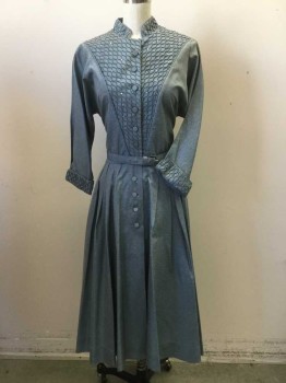 NL  , Slate Blue, Silk, Rayon, Heathered, Covered Button Placet Front. Diamond Shaped Textured Pleated Bib Front, Cuffs & Collar Band with Rhinestones.fitted Dolman Sleeves. Skirt Pleated to Waist with Self Belt. Stain at Front Button Opening at Neckline