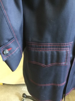 GROUP II By HOWARD , Navy Blue, Polyester, Cotton, Solid, Double Red Top-stitches Large Notched Lapel, Placket 3 Button Front,  2 Pockets with Flap, and Hem, Epaulettes,  Long Sleeves with Short Belt & Matching Button. Red with Royal Blue Geometric Print Lining. 2 Seam Center Back with Split Hem