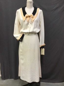 N/L, Cream, Black, Tan Brown, Off White, Rayon, Solid, Cream W/large Tan,black W/off White Piping Trim Collar Attached and Back Flap, Tan Bow-tie, Long Sleeves W/matching Tan,black Trim W/Gold Outline Button, Flair Bottom, Odd Shapes Button Front, Side Zip, NO BELT