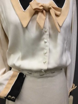 N/L, Cream, Black, Tan Brown, Off White, Rayon, Solid, Cream W/large Tan,black W/off White Piping Trim Collar Attached and Back Flap, Tan Bow-tie, Long Sleeves W/matching Tan,black Trim W/Gold Outline Button, Flair Bottom, Odd Shapes Button Front, Side Zip, NO BELT