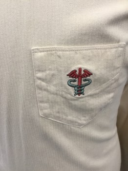 MTO, Cream, Cotton, Herringbone, Doctor's Gown/Jacket, Crossover Front, Mother of Pearl Shoulder Buttons and Side Buttons, Stand Collar, Long Sleeves, Embroidered Medical Caduceus on Pocket, Floor Length, Pleated at Back Waistband with Mother of Pearl Buttons, Side Vent Slits **Sleeves Shortened/Cuffs Removed