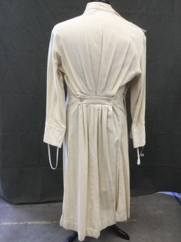 MTO, Cream, Cotton, Herringbone, Doctor's Gown/Jacket, Crossover Front, Mother of Pearl Shoulder Buttons and Side Buttons, Stand Collar, Long Sleeves, Embroidered Medical Caduceus on Pocket, Floor Length, Pleated at Back Waistband with Mother of Pearl Buttons, Side Vent Slits