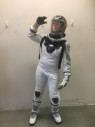MTO, White, Gray, Navy Blue, Metallic/Metal, Synthetic, Novelty Pattern, Textured Fabric, Hips 42", White Knit, Light Gray Textured  Dotted Stripe Body Suit, Clear Gel Like Shoulders & Sleeves, Black Webbing Harness with a Fiber Glass Center Front, Metal Cuffs, Charcoal Rubber Elbow Pads, Spacesuit, EVA, Astronaut, Has Holes Center Back for Oxygen Back Pack, Attaches to Gloves See FC031865, Boots See FC045658, Separate Rental For Helmet with Gasket CF015179